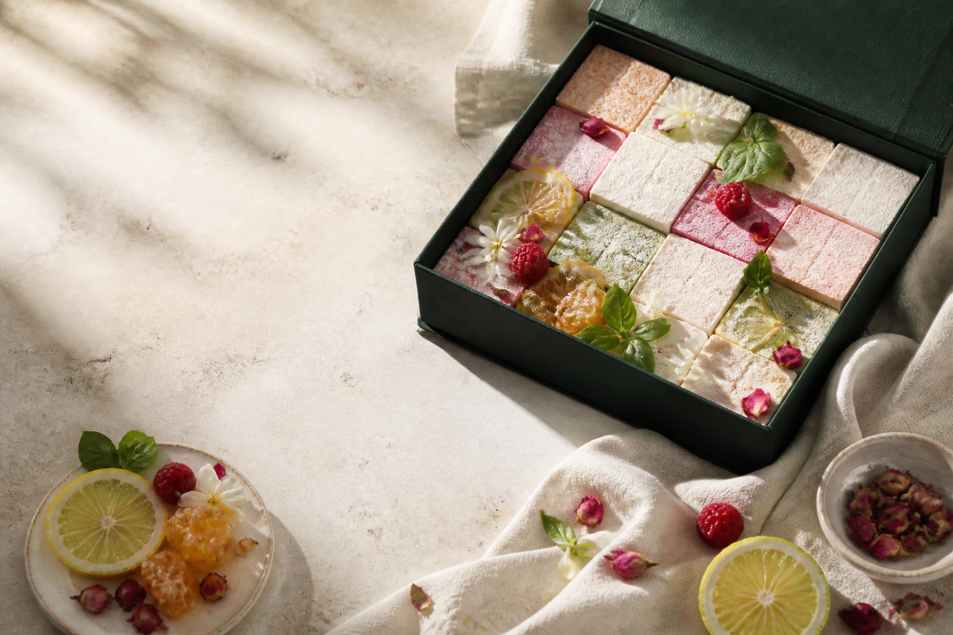 Nectar & Zest botanical marshmallows with citrus, herbs, flowers, and gift packaging